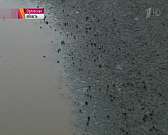 Укладку асфальта в снег на Наугорском шоссе показали на «Первом канале»